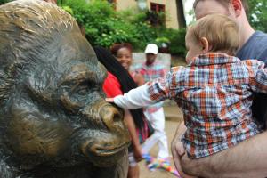 Tyler rubbing the gorilla's nose for good luck.  It's like Lincoln's nose right?!